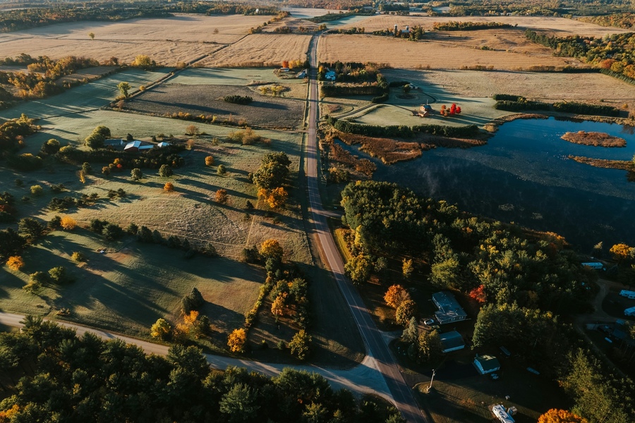 Aerial view of agricultural landscape with a lake